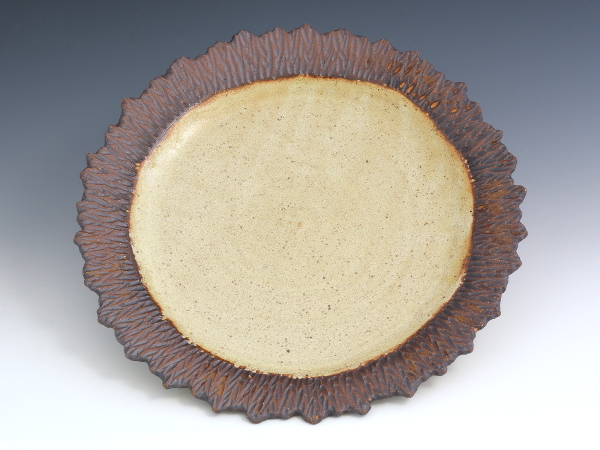 Carved rim plate